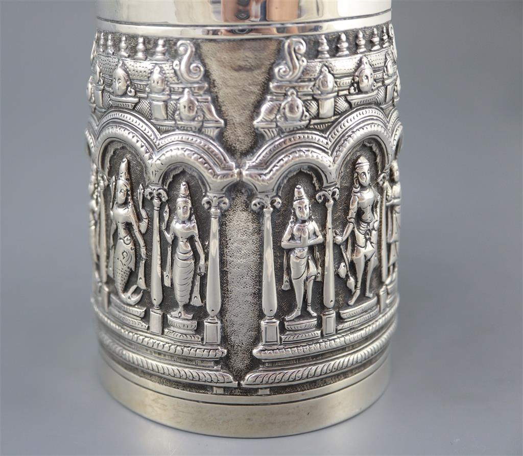 A late 19th century Indian repousse silver mug by P. Orr & Sons, Madras,